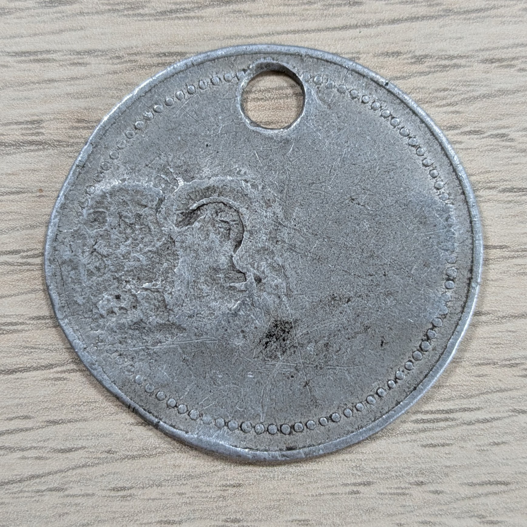Taïette 9282 — revers, usé par le temps
